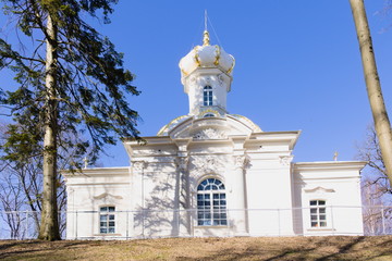 Fototapeta na wymiar A small Orthodox Church on the Hill against the sky