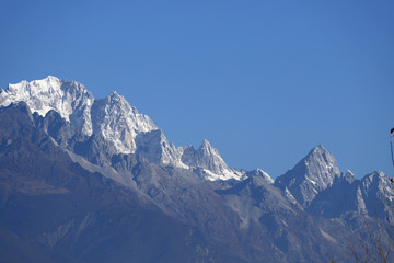 View of the snow-capped peaks of the Jade Dragon Snow Mountain. The mountain overlooking the city of Lijiang, Yunnan, China