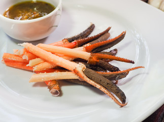 Legs giant prawns steamed and served on white plate.