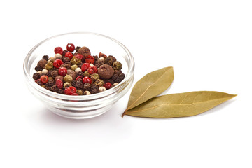 Mixed peppercorns in a bowl, spices, close-up, isolated on white background
