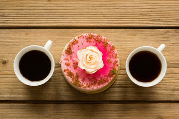 cup of coffee and cake on wooden table