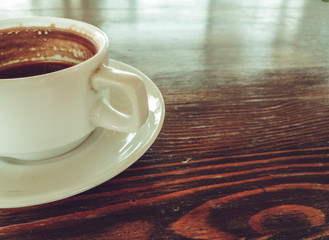 a Cup of natural black coffee on a wooden table in a seaside cafe