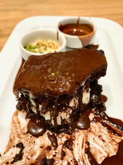Flowing Chocolate Sauce from the Cake with Ice Cream / Brownie