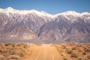Fototapeta na wymiar Unpaved road through the Sierra Nevada - travel photography