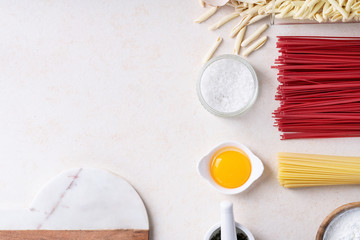 Fototapeta na wymiar Raw ingredients for cooking pasta