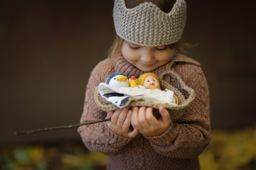 golden autumn and girl child with basket of toys