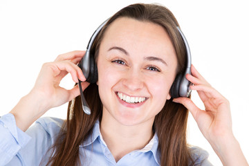 Smiling woman using an headset in call center