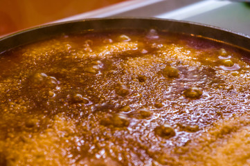 Preparation of Uzbek pilaf - evaporation of water from rice, close up