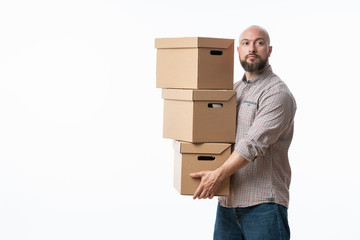 Portrait of a handsome young man holding card boxes, isolated on white