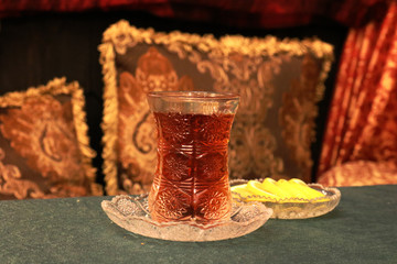 Azerbaijan tea in a glass armudu. Tea with lemon