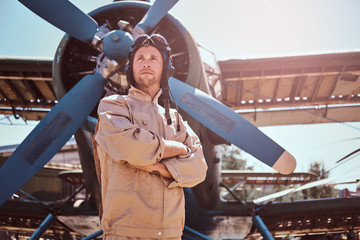 Young pilot is thoughtfully looking up. © Fxquadro