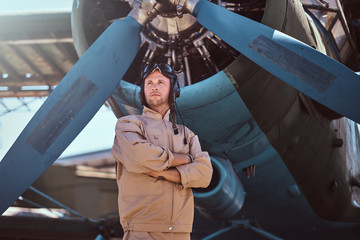 Young pilot is thoughtfully looks away. © Fxquadro