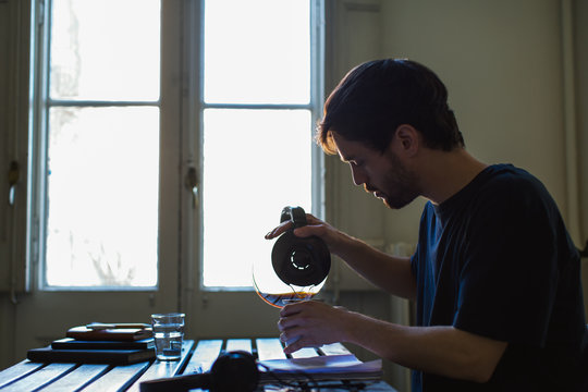 Young man reading script at home.
