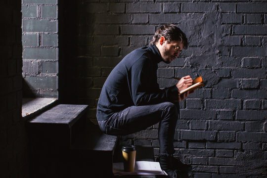 Actor reviewing script in theatre.