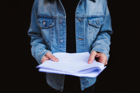 Actor reading script on the street.