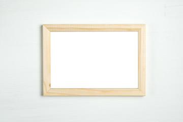 wooden frame on a white wooden background.