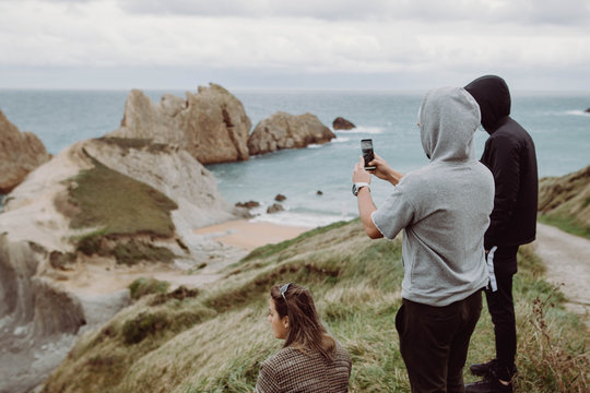 Friends on a cliff with the plants