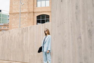 Trendy confident model in blue suit