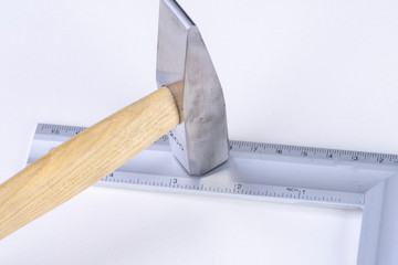 hammer on ruler made of iron