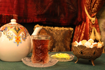 Azerbaijan tea in a glass armudu. Tea with lemon