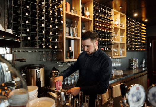 Professional bartender making coffee