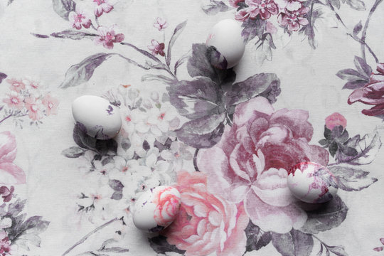Close up of Easter eggs on floral table cloth