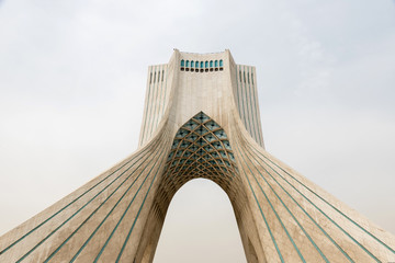 Modern tower and cloudy sky