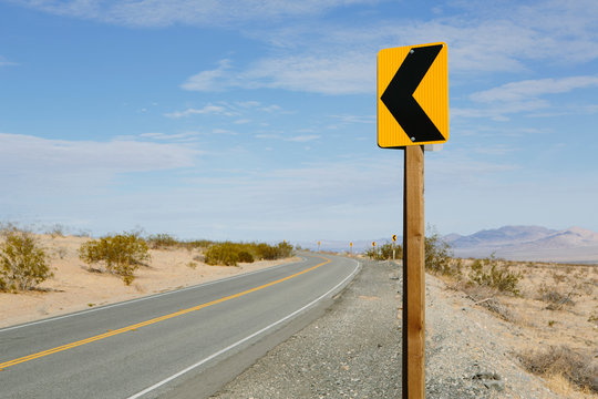 Turn ahead sign along remote desert road