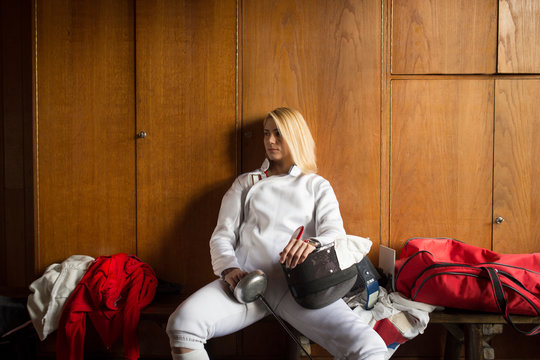 Female fencer in locker room.