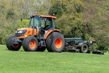 Orange tractor lawnmower