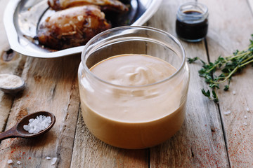 Obraz na płótnie Canvas Homemade mayonnaise sauce. Soy sauce. Rosemary. Ginger. Salt. Wooden table. 