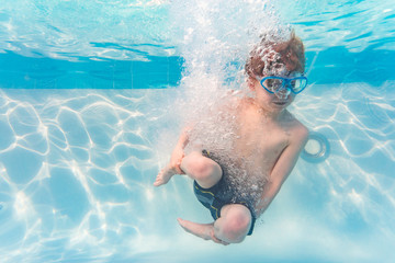 Boy on family vacation dives cannonball into swimming pool
