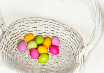 Fototapeta na wymiar easter eggs in white basket