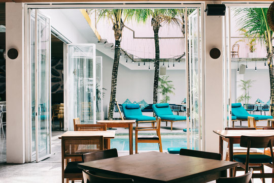 Sunbeds and Tables in Stylish Tropical Beach Club