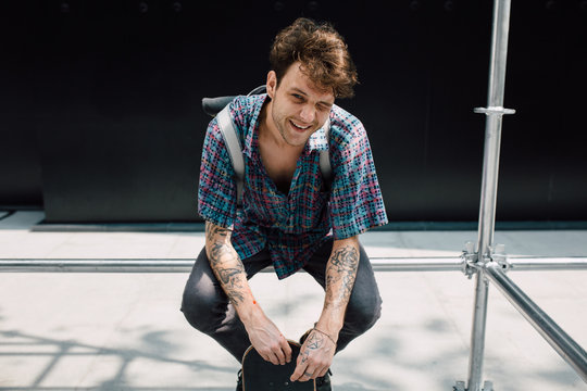 Portrait of young skater in the city