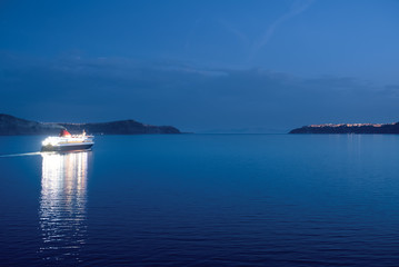 Ferry moving in the quiet sea, night view 