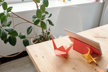Origami cranes on table