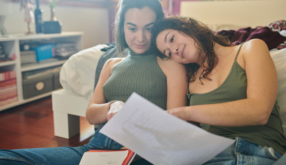 Lovely girls studying together.