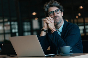 Handsome businessman working at the office.