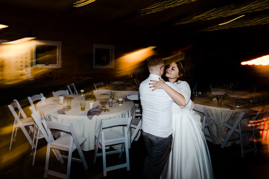 bride and groom dancing in reception hall.