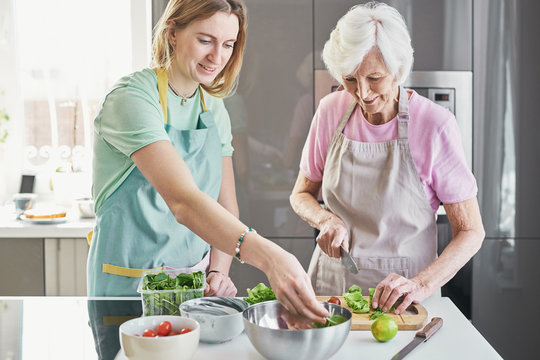 Woman Cooking Lunch With Grandma