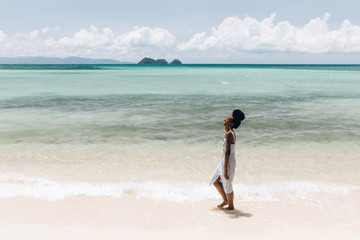 Beautiful african american woman at the beach