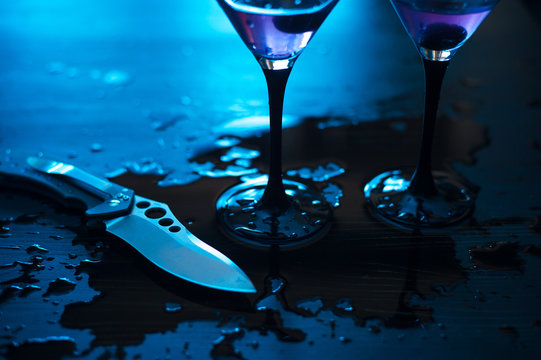 knife with martini splashes - conflict concept