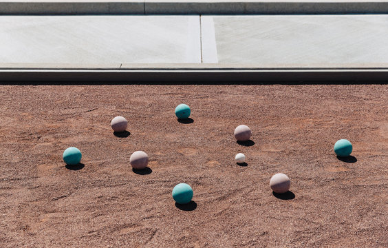 Bocce Balls on Red Clay Court