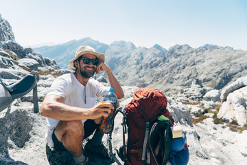 Happy hiker on mountain summit