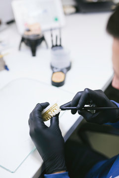 Dental technician making new teeth