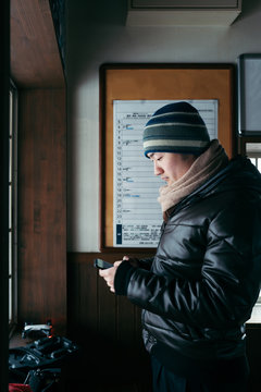 Young Asian man debugging an aircraft by the window