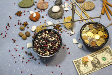 composition with scales, white beans, red beans and coins
