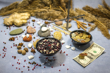 composition with scales, white beans, red beans and coins