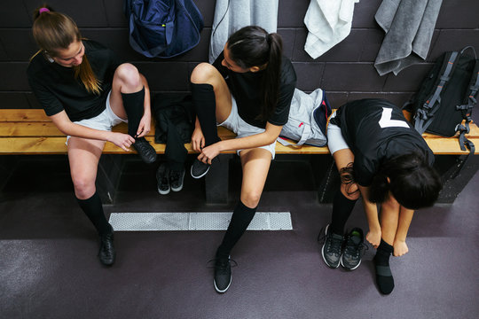 Young women together in locker room.